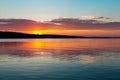 Gorgeous orange teal sunset on huge calm lake