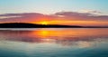 Gorgeous orange teal sunset on huge calm lake