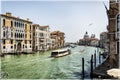 A gorgeous panorama of Grand Canal in Venice, Italy. Waterbus, aka vaporetto, ancient palaces, gondolas, seagull and Salute Church