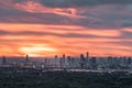 Gorgeous panorama scenic of the sunrise with cloud on the orange sky over large metropolitan city in Bangkok