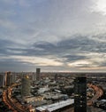 Gorgeous panorama scenic of the sunrise or sunset with cloud on the orange and blue sky over large metropolitan city in Bangkok