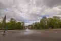 Gorgeous panoramic view of road going down to downtown covered with cloudy blue sky.