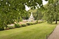 Petergof, Russia, July 2019.View of the fountain in the lower park through the foliage of trees. Royalty Free Stock Photo