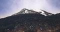 Gorgeous picturesque dramatic mountain landscape snow peak highland scenic view wallpaper moody cloudy sky background