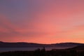 Gorgeous pink and purple sunset sky over Argentino lake in the town of El Calafate, Patagonia, Argentina, South America