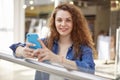 Gorgeous portrait photography, which depicts person who is stand indoors, look directly into frame and smile. On face blue eyes