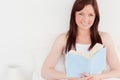 Gorgeous red-haired female reading a book Royalty Free Stock Photo