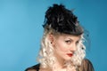 Gorgeous retro girl in forties hat with feathers Royalty Free Stock Photo