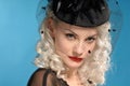 Gorgeous retro girl in forties hat with feathers Royalty Free Stock Photo