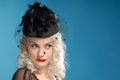 Gorgeous retro girl in forties hat with feathers Royalty Free Stock Photo