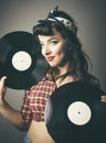 Gorgeous retro pin up girl posing with records