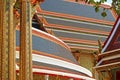 Gorgeous Roofs Covered with Colorful Glazed Tiles of Wat Ratchabophit Buddhist Temple Complex, Thailand Royalty Free Stock Photo