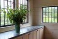 Beautiful scene of room filled with flowers, windows and counters in cooking area, Berkshire Botanical Gardens, Stockbridge 2019 Royalty Free Stock Photo