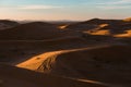 Gorgeous and scenic desert sunset scene above beautiful sand dunes Erg Chebbi, Morocco, Merzouga Royalty Free Stock Photo