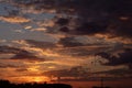 Gorgeous scenic of the sunrise or sunset with dark lining and cloud on the orange sky. Vibrant and Colorful background