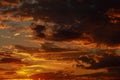 Gorgeous scenic of the sunrise or sunset with dark lining and cloud on the orange sky. Vibrant and Colorful background