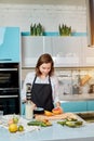 Gorgeous serious girl cutting grapefruit Royalty Free Stock Photo