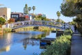 A gorgeous shot of the lush green waters of the canal with colorful boats and lush green trees and plants reflecting off the water Royalty Free Stock Photo