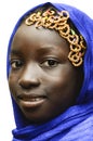 Gorgeous Smiling African Schoolgirl Veiled by a Blue Typical African Hijab Royalty Free Stock Photo
