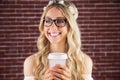 Gorgeous smiling blonde hipster with floral headband and coffee