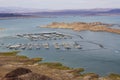 a gorgeous spring landscape at Lake Mead with vast blue water and majestic mountain ranges and boats and yachts docked Royalty Free Stock Photo