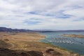 a gorgeous spring landscape at Lake Mead with vast blue water and majestic mountain ranges and boats and yachts docked Royalty Free Stock Photo