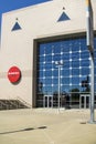 a gorgeous spring landscape at State Farm Arena with a statue of Evander Holyfield in front and blue sky in Atlanta Georgia