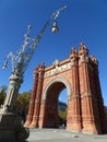 Gorgeous street lamp and stunning Triumphal Arch of Barcelona Royalty Free Stock Photo