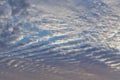 GORGEOUS STRIATED CLOUD FORMATION. STRATOCUMULUS UNDULATUS, FILLS UP THE SKY WITH BLUE AND ORANGE HUES Royalty Free Stock Photo