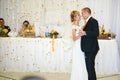 gorgeous stylish happy bride and groom performing their emotional first dance, wedding in a restaurant Royalty Free Stock Photo