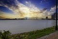 a gorgeous summer landscape along the Mississippi River with the Crescent City Connection bridge over the water Royalty Free Stock Photo