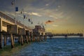 A gorgeous summer landscape at the Belmont Veterans Memorial Pier with blue ocean water and waves rolling into the beach Royalty Free Stock Photo