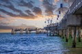 A gorgeous summer landscape at the Belmont Veterans Memorial Pier with blue ocean water and waves rolling into the beach Royalty Free Stock Photo