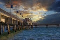 A gorgeous summer landscape at the Belmont Veterans Memorial Pier with blue ocean water and waves rolling into the beach Royalty Free Stock Photo