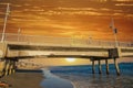 A gorgeous summer landscape at the Belmont Veterans Memorial Pier with blue ocean water and waves rolling into the beach Royalty Free Stock Photo