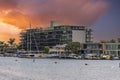 a gorgeous summer landscape at Horny Corner Beach with luxury apartments, blue ocean water, with boats and yachts docked Royalty Free Stock Photo