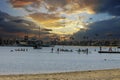 a gorgeous summer landscape at Horny Corner Beach with people sailing boats and people rowing paddle boards with yachts Royalty Free Stock Photo