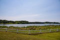 A gorgeous summer landscape at Lake Acworth with rippling blue lake water surrounded by lush green grass and trees Royalty Free Stock Photo