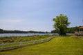 A gorgeous summer landscape at Lake Acworth with rippling blue lake water surrounded by lush green grass and trees Royalty Free Stock Photo