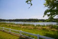 A gorgeous summer landscape at Lake Acworth with rippling blue lake water surrounded by lush green grass and trees Royalty Free Stock Photo