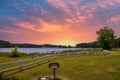 A gorgeous summer landscape at Lake Acworth with rippling blue lake water surrounded by lush green grass and trees Royalty Free Stock Photo