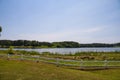 A gorgeous summer landscape at Lake Acworth with rippling blue lake water surrounded by lush green grass and trees Royalty Free Stock Photo