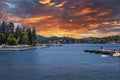 A gorgeous summer landscape at Lake Arrowhead with rippling blue water, boats and yachts docked along the banks, lush green trees Royalty Free Stock Photo