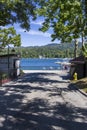 A gorgeous summer landscape at Lake Arrowhead village with boats and yachts sailing on the rippling blue later water, homes