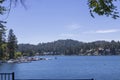 A gorgeous summer landscape at Lake Arrowhead Village with rippling blue water, boats and yachts docked along the banks, lus Royalty Free Stock Photo