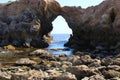 A gorgeous summer landscape at Little Corona del Mar Beach with large brown rocks along the beach and blue ocean water Royalty Free Stock Photo