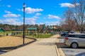 A gorgeous summer landscape in the park with green park with a playground with jungle gyms and swings