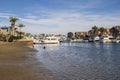 A gorgeous summer landscape at Seabridge Park with kids playing in the water, boats and yachts in the harbor