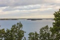 Gorgeous summer landscape view.  Baltic sea water mirror surface with islands and blue sky with white clouds background. Royalty Free Stock Photo