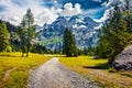 Gorgeous summer view of mountain range from the Oeschinen Lake. Incredible morning scene of Swiss Alps, Kandersteg village locatio Royalty Free Stock Photo